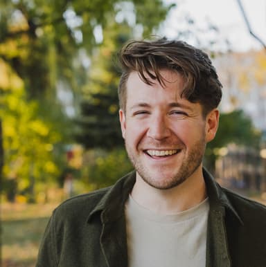 A picture of colbyr by a lake.